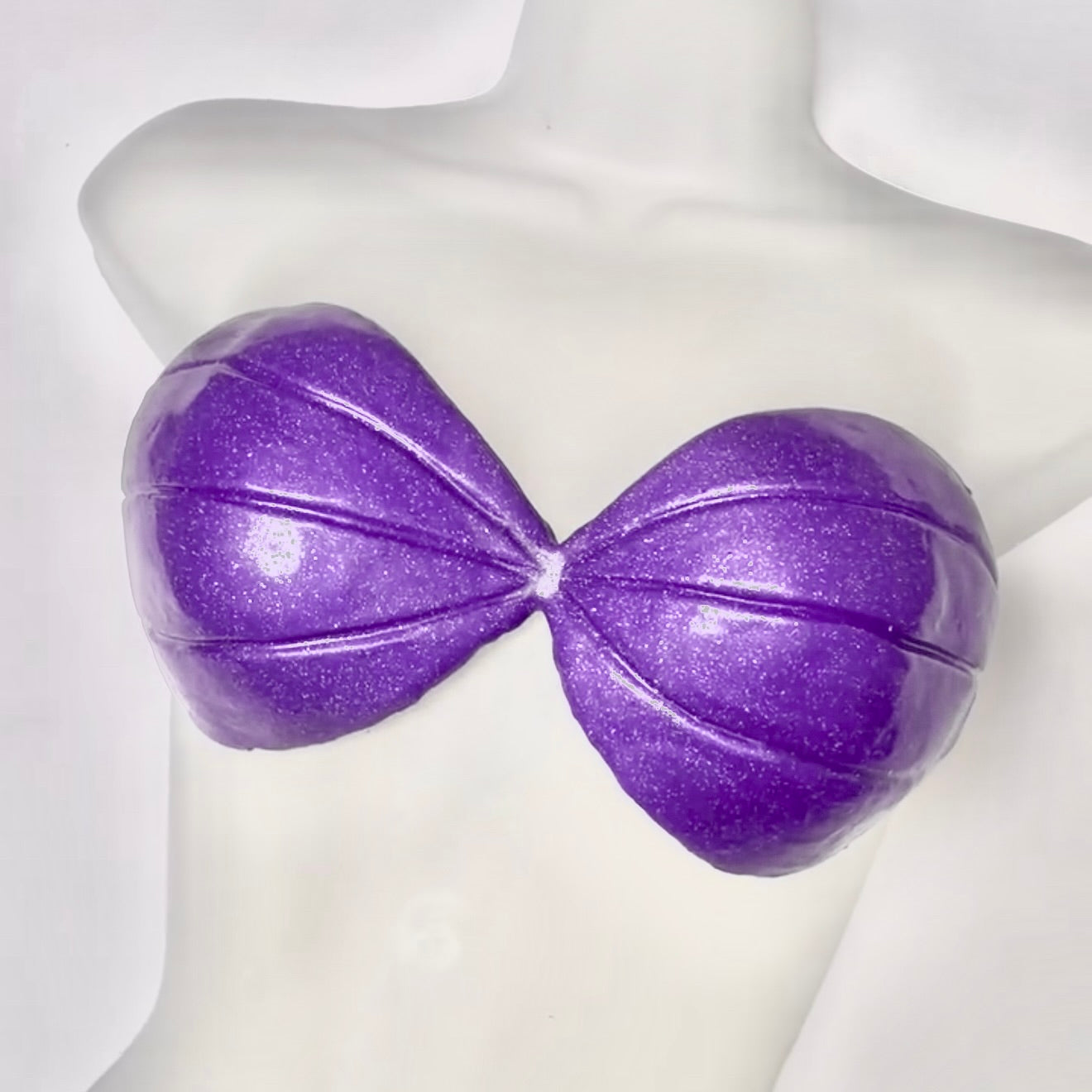 Purple glittery bra on a mannequin bust against a white background. Handmade silicone mermaid top for underwater photoshoots, Ariel Little Mermaid design, cosplay